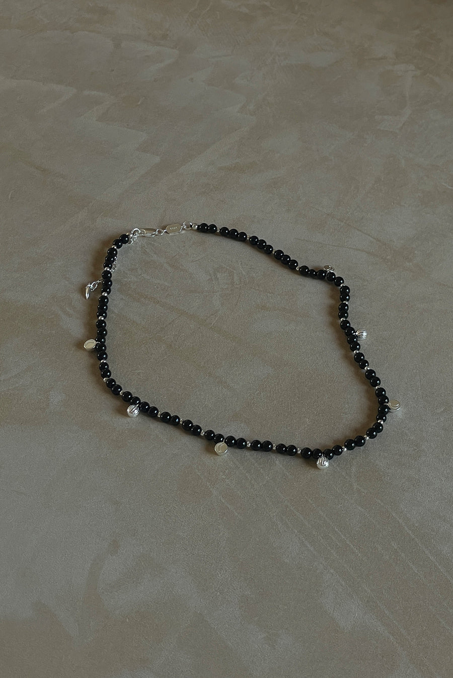 Black Bead Necklace With Silver Pendants